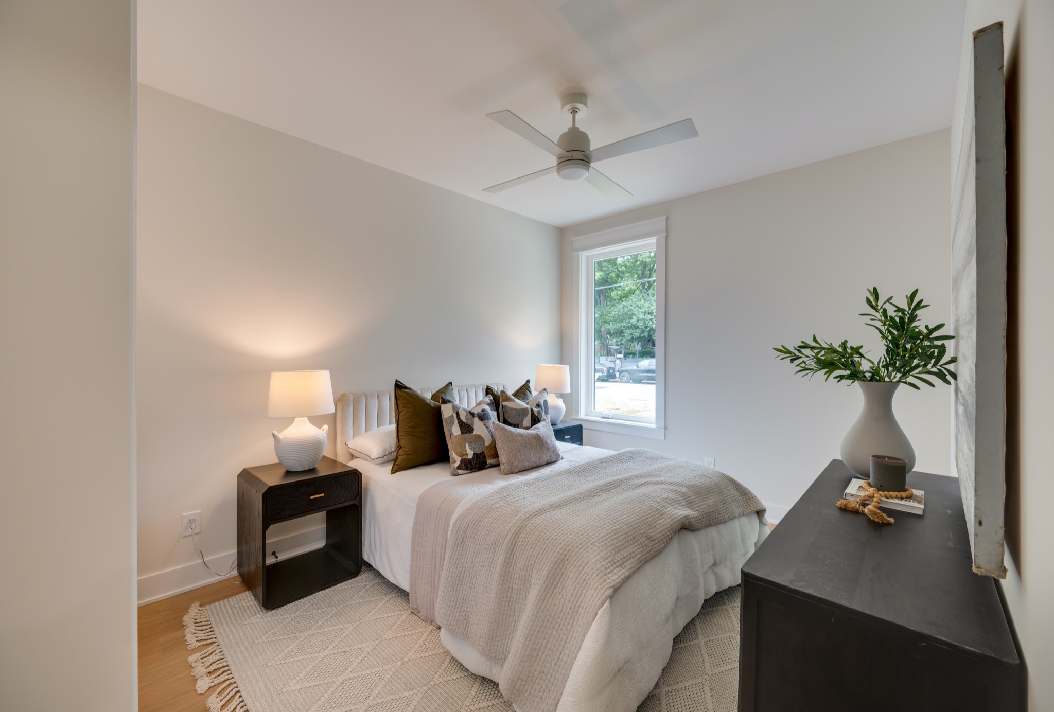 704 Stockell Street Nashville, TN 37207 - Photo 10 of 32 a bedroom with furniture and a chandelier
