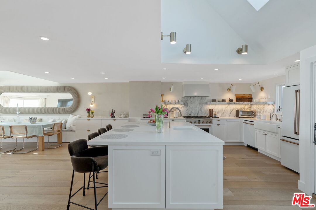 3521 Ocean Drive Oxnard, CA 93035 - Photo 19 of 53 a kitchen with appliances cabinets and chair