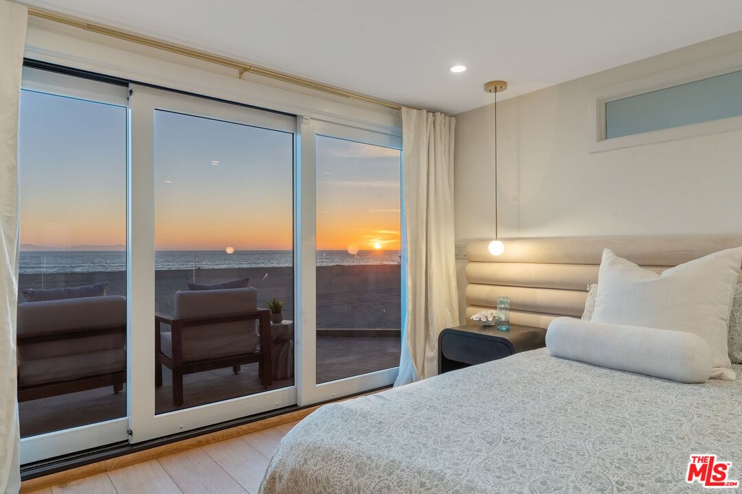 3521 Ocean Drive Oxnard, CA 93035 - Photo 24 of 53 a bedroom with a bed and a walk in closet