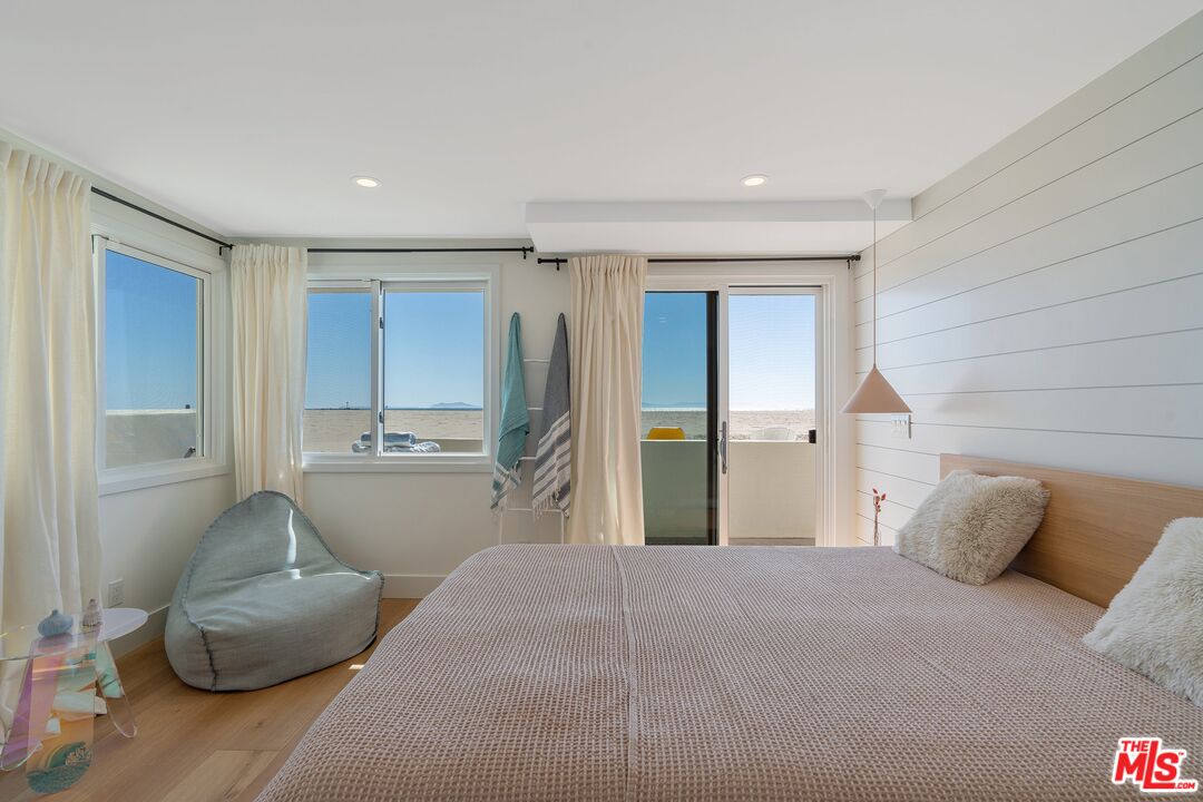 3521 Ocean Drive Oxnard, CA 93035 - Photo 32 of 53 a bedroom with a bed and a couch