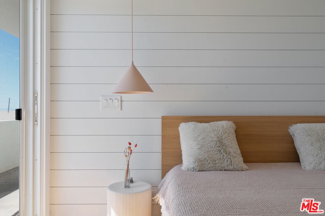 3521 Ocean Drive Oxnard, CA 93035 - Photo 35 of 53 a bedroom with a bed and a potted plant