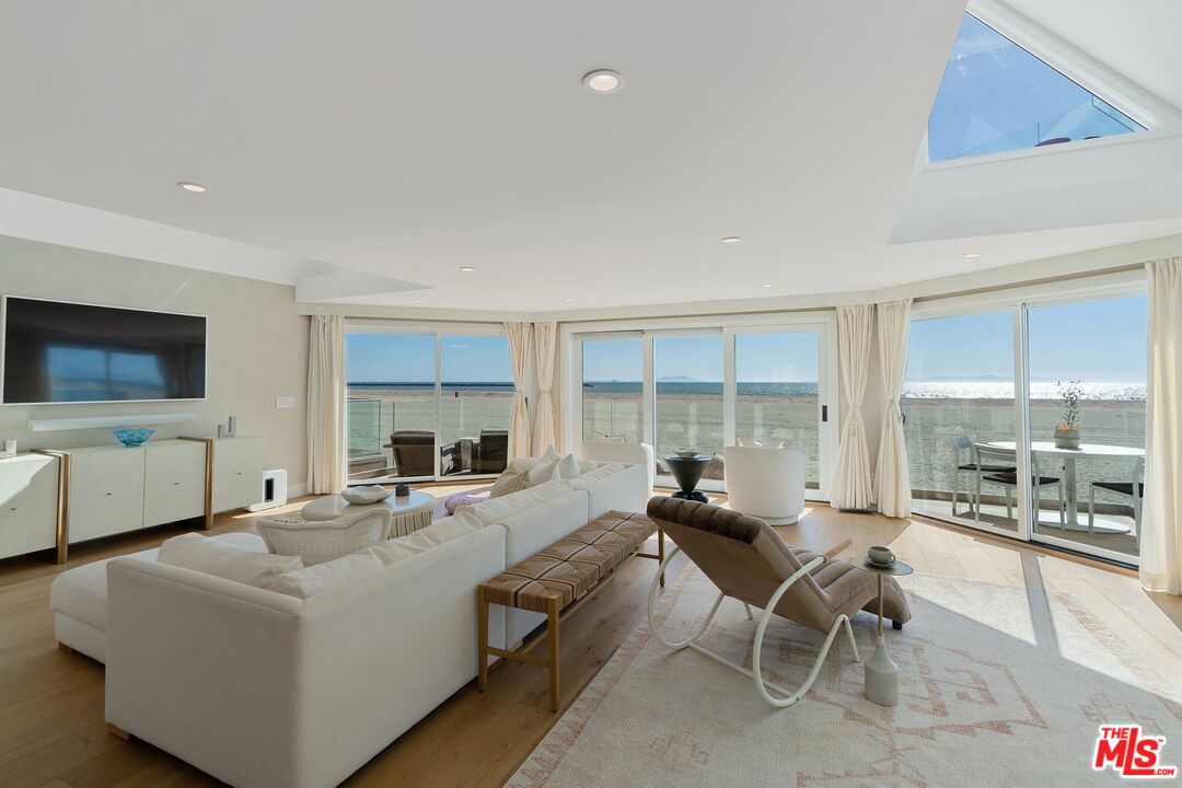 3521 Ocean Drive Oxnard, CA 93035 - Photo 42 of 53 a living room with furniture and a flat screen tv