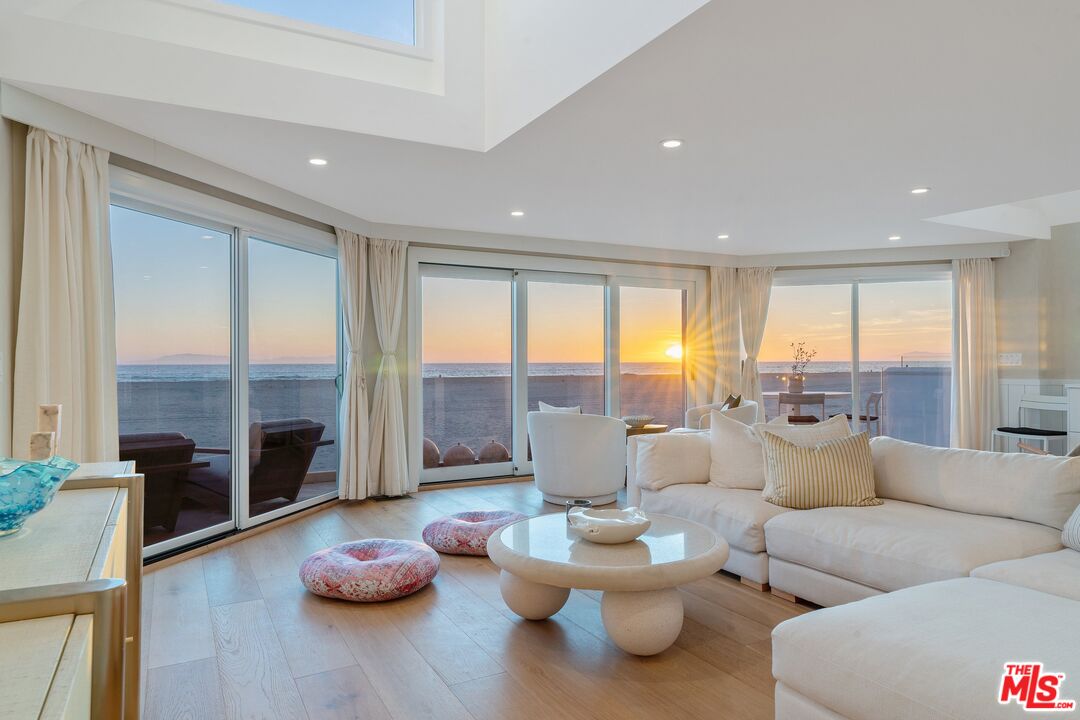 3521 Ocean Drive Oxnard, CA 93035 - Photo 46 of 53 a living room with furniture and floor to ceiling windows