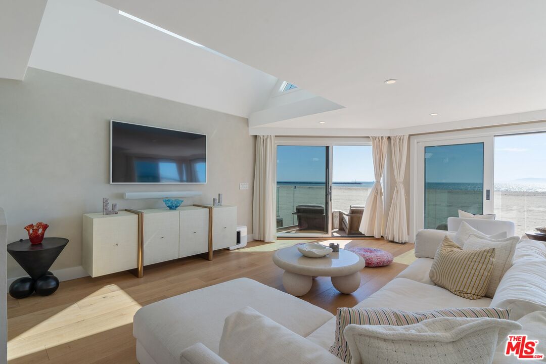 3521 Ocean Drive Oxnard, CA 93035 - Photo 10 of 53 a living room with furniture and a flat screen tv