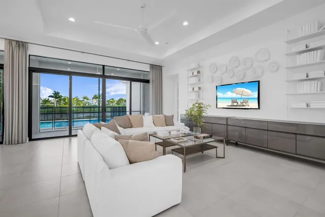 a living room with furniture and painting on the wall