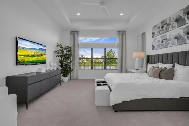 a bathroom with a tub a sink and a window