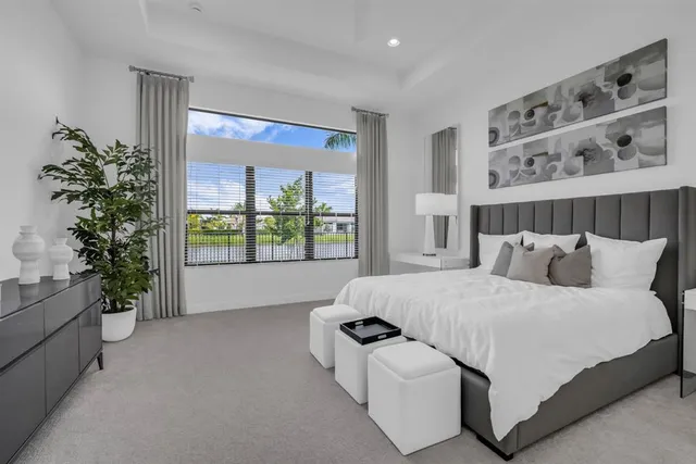 a bathroom with a sink a granite counter top a sink and a large mirror
