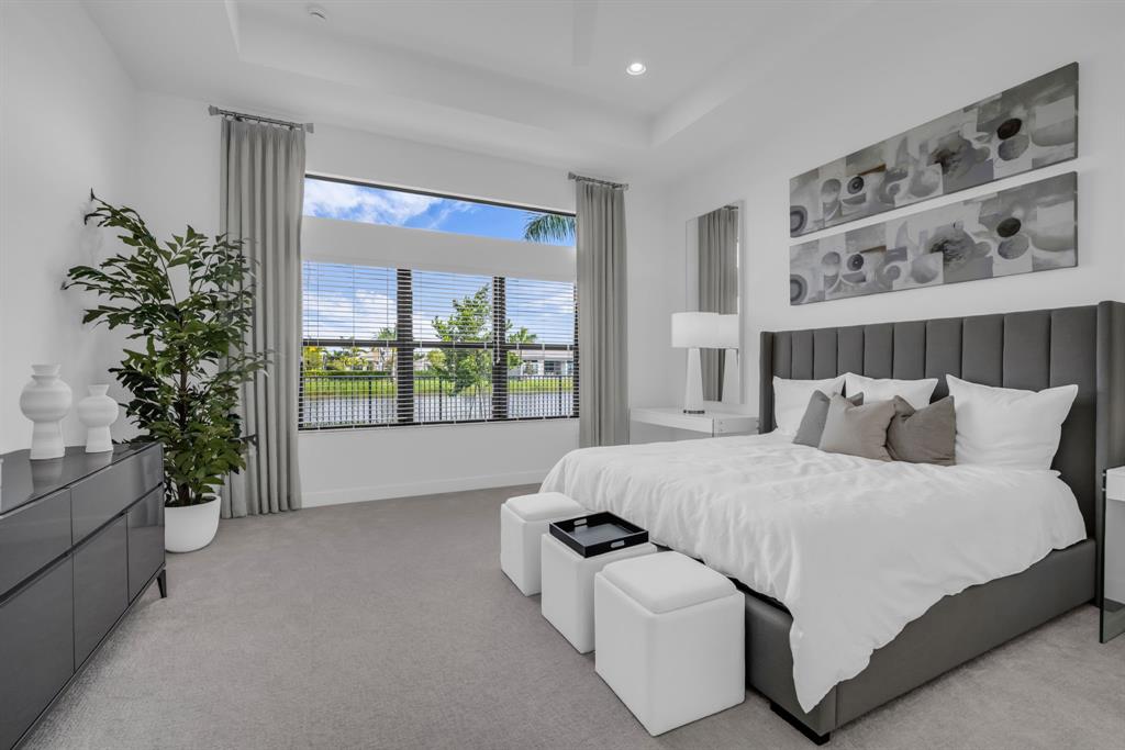 11242 Gln Orch Lane Boynton Beach, FL 33473 - Photo 25 of 55 a bed sitting in a bedroom next to a window