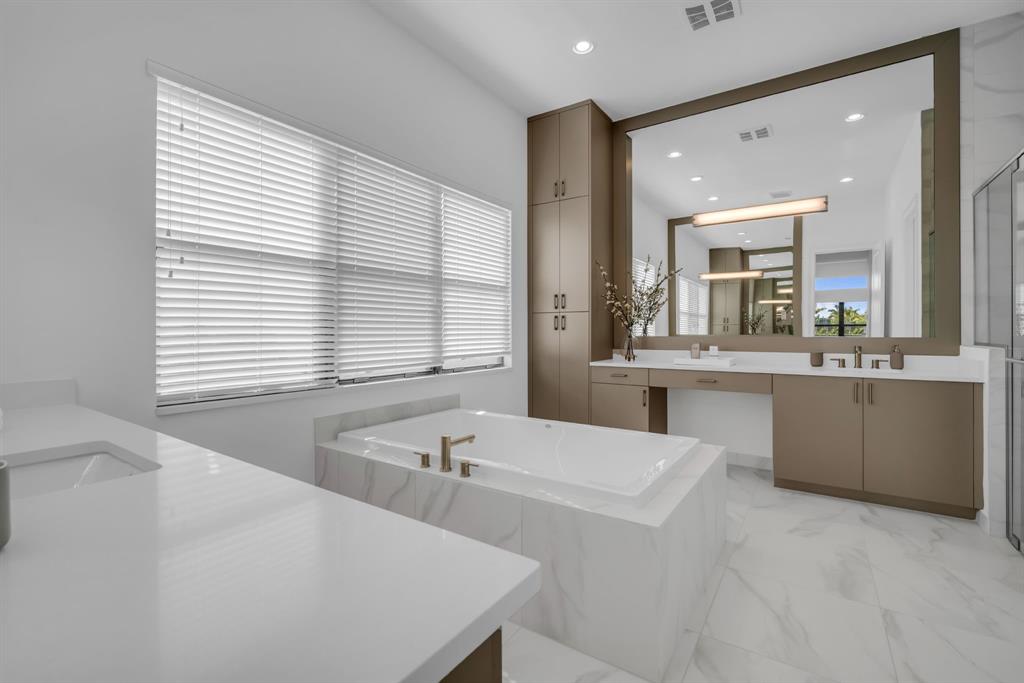 11242 Gln Orch Lane Boynton Beach, FL 33473 - Photo 26 of 55 a bathroom with a tub a sink and a window