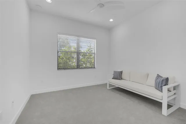 a bathroom with a toilet sink vanity and shower