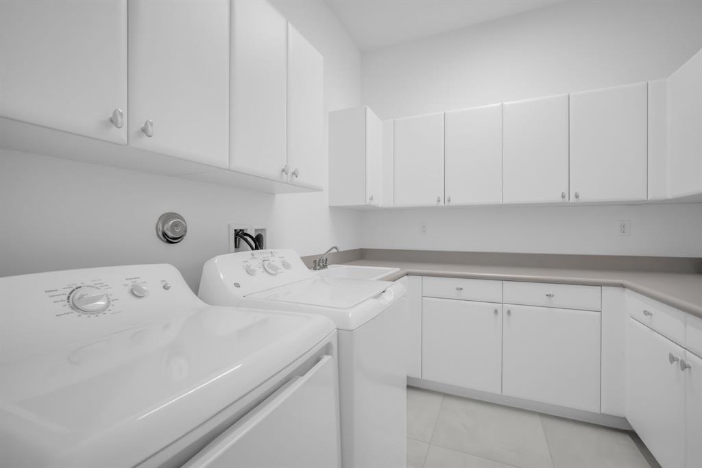 11242 Gln Orch Lane Boynton Beach, FL 33473 - Photo 40 of 55 a kitchen with white cabinets and sink