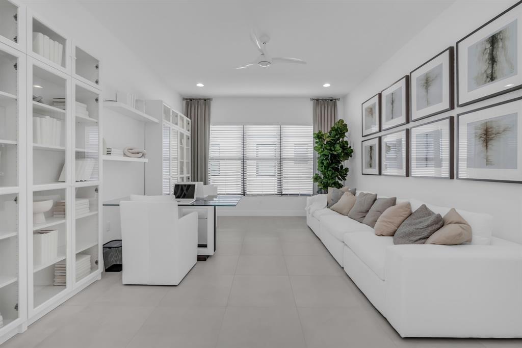 11242 Gln Orch Lane Boynton Beach, FL 33473 - Photo 6 of 55 a living room with furniture a large window and white walls