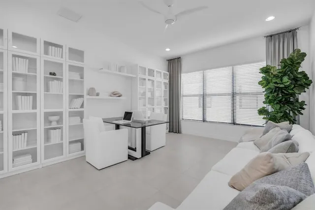 a kitchen with stainless steel appliances a refrigerator and microwave