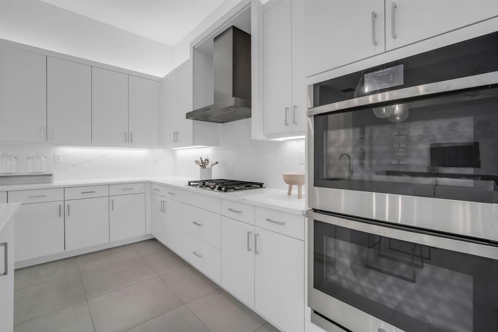 11242 Gln Orch Lane Boynton Beach, FL 33473 - Photo 10 of 55 a kitchen with white cabinets and white appliances