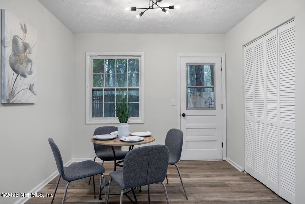 4634 Whimbrel Lane Fernandina Beach, FL 32034 - Photo 16 of 42 a view of a dining room with furniture window and outside view