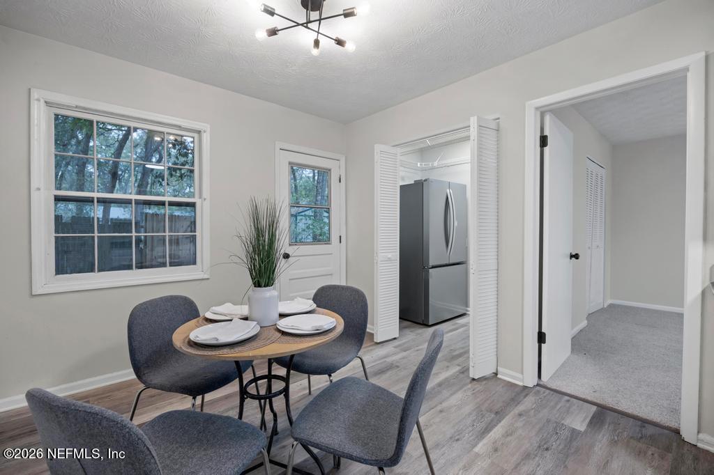 4634 Whimbrel Lane Fernandina Beach, FL 32034 - Photo 18 of 42 a view of a room with a table and chairs