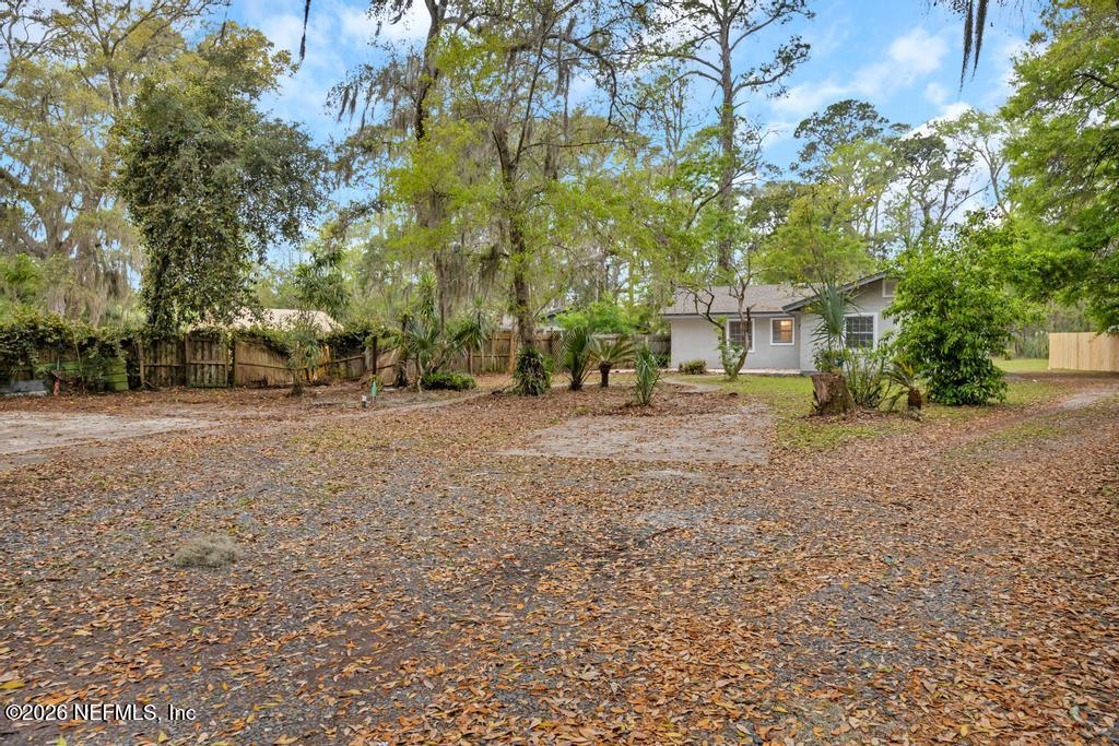 4634 Whimbrel Lane Fernandina Beach, FL 32034 - Photo 2 of 42 a view of road with large trees