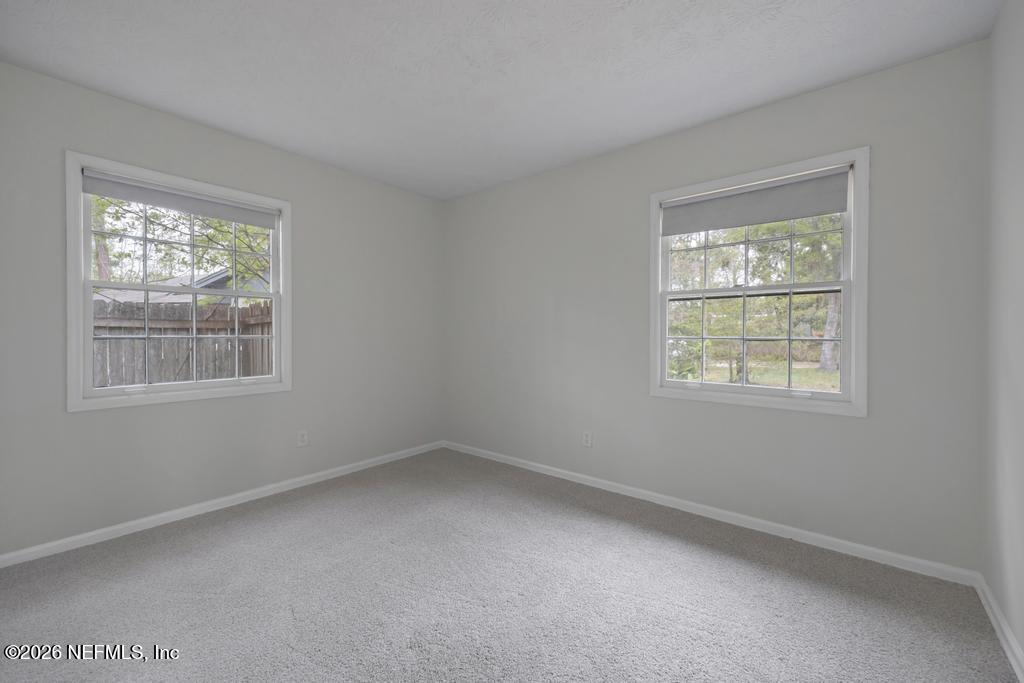 4634 Whimbrel Lane Fernandina Beach, FL 32034 - Photo 26 of 42 an empty room with a window