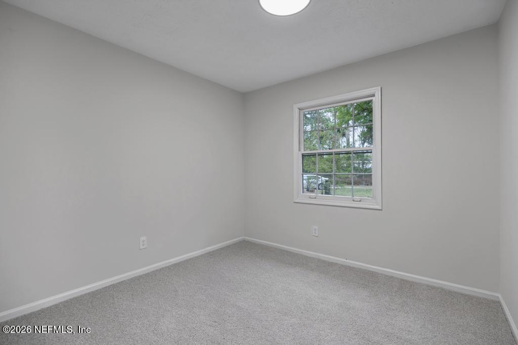 4634 Whimbrel Lane Fernandina Beach, FL 32034 - Photo 28 of 42 an empty room with a window