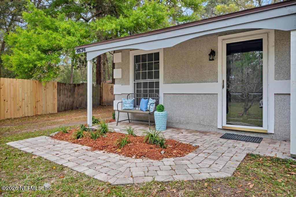4634 Whimbrel Lane Fernandina Beach, FL 32034 - Photo 3 of 42 a front view of a house with garden