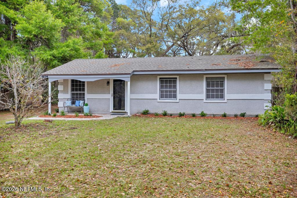 4634 Whimbrel Lane Fernandina Beach, FL 32034 - Photo 35 of 42 front view of house with a yard