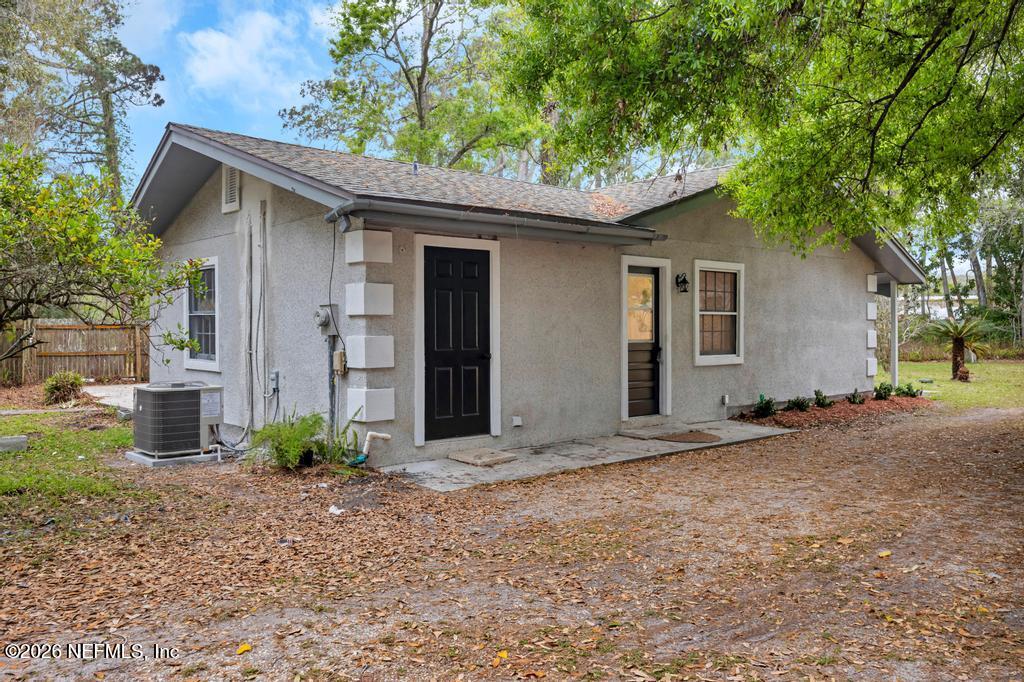 4634 Whimbrel Lane Fernandina Beach, FL 32034 - Photo 37 of 42 a view of a house with a yard