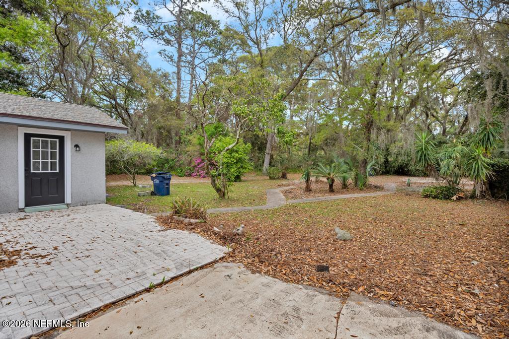 4634 Whimbrel Lane Fernandina Beach, FL 32034 - Photo 39 of 42 a view of a yard with a tree