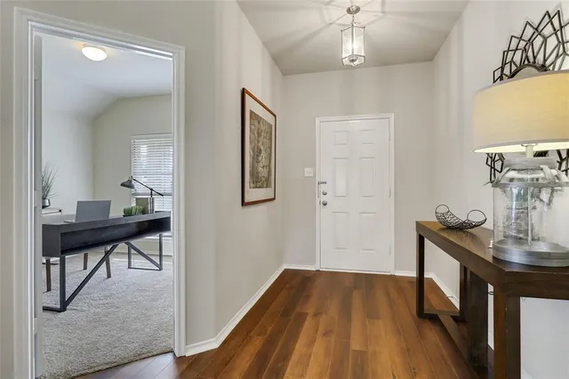a view of a livingroom with furniture and wooden floor