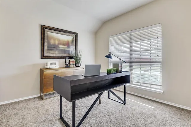 a view of a workspace with furniture