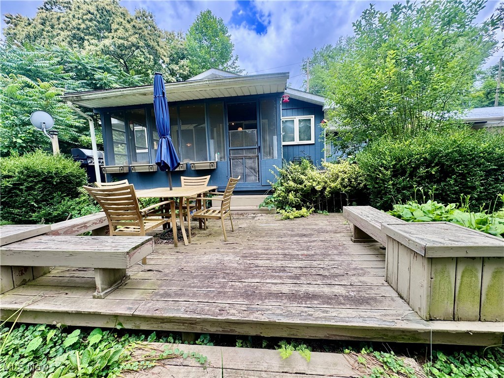 1470 South Riverview Road Stockport, OH 43787 - Photo 6 of 24 Wooden terrace featuring outdoor dining area and area for grilling
