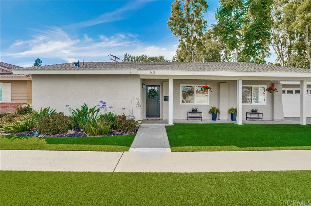 Main house - landscaped front yard with gardens and artificial turf, pathway, porch and front door