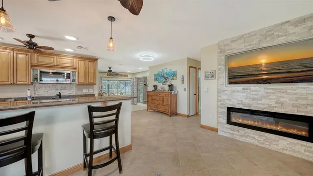 a kitchen with stainless steel appliances granite countertop a stove and cabinets