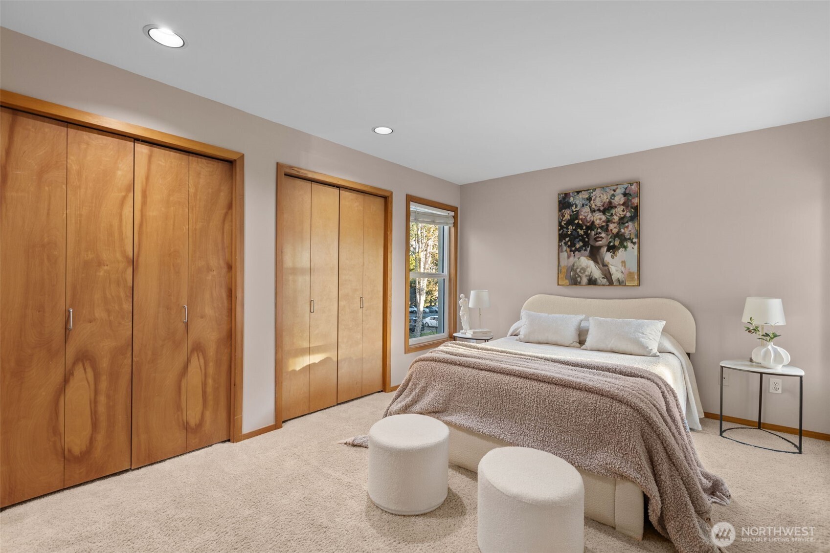 3200 Alki Avenue Southwest, Unit 301 Seattle, WA 98116 - Photo 13 of 29 a bedroom with a large bed and a painting on the wall