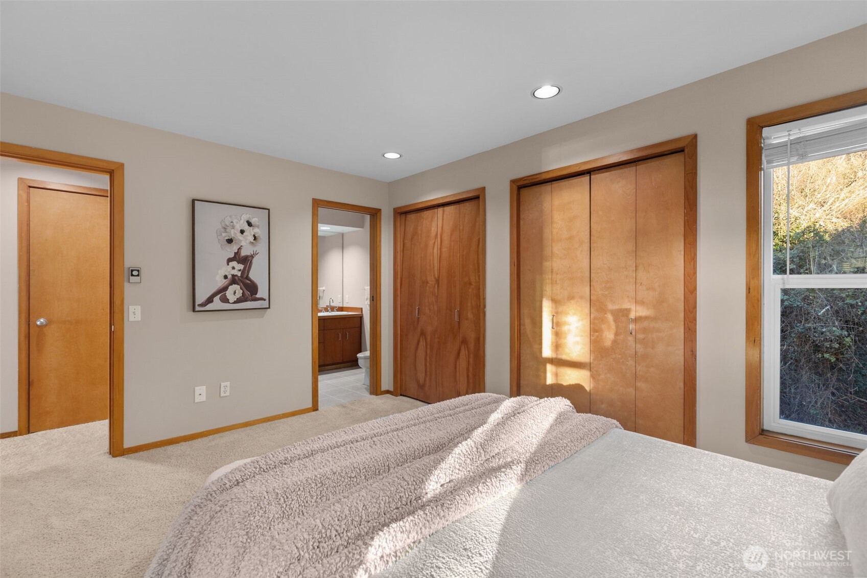 3200 Alki Avenue Southwest, Unit 301 Seattle, WA 98116 - Photo 14 of 29 a bedroom with a large bed and a window