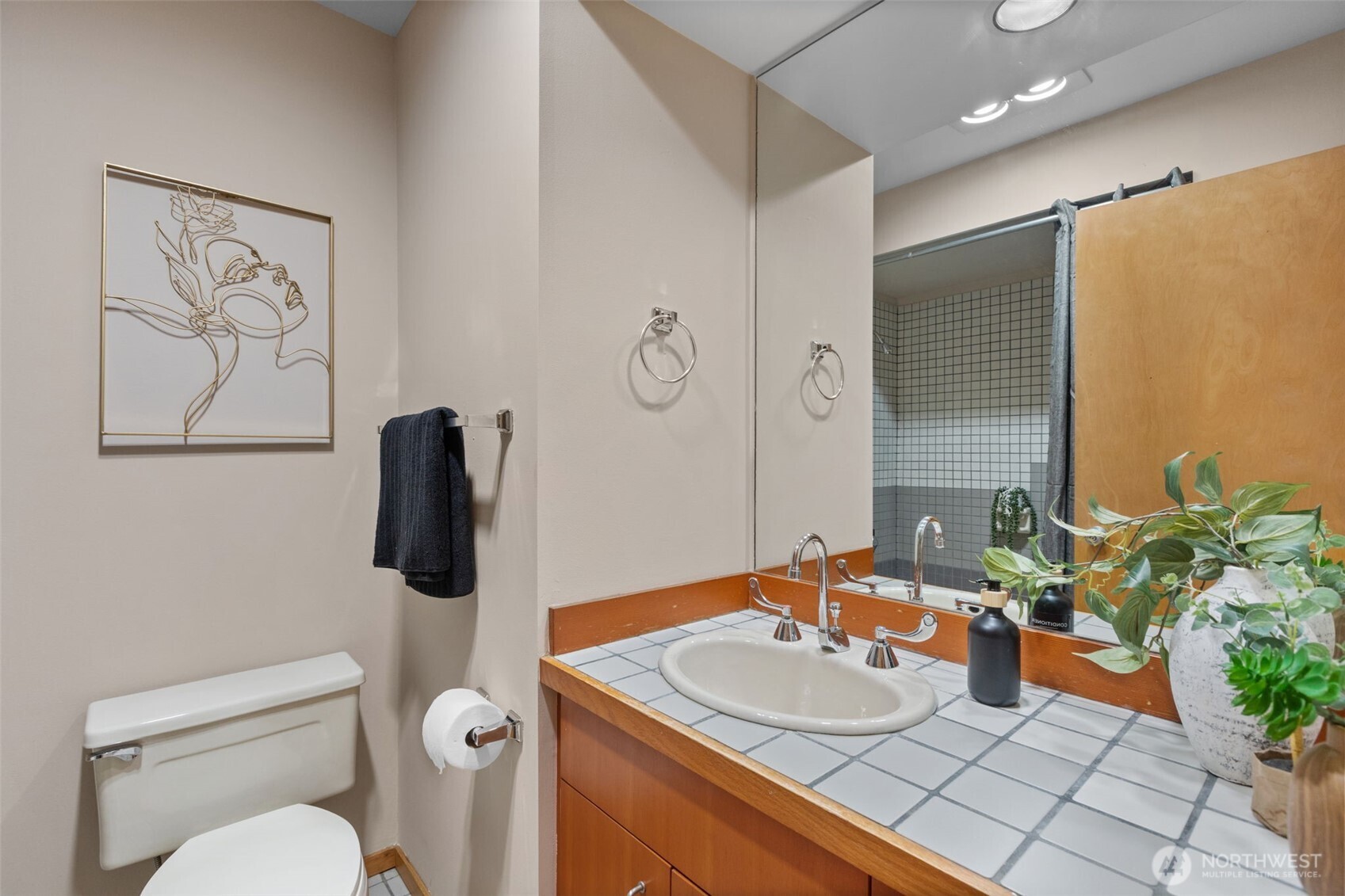 3200 Alki Avenue Southwest, Unit 301 Seattle, WA 98116 - Photo 20 of 29 a bathroom with a sink toilet and shower