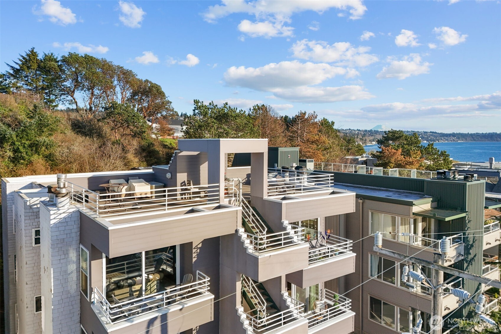 3200 Alki Avenue Southwest, Unit 301 Seattle, WA 98116 - Photo 2 of 29 an aerial view of a building with a yard