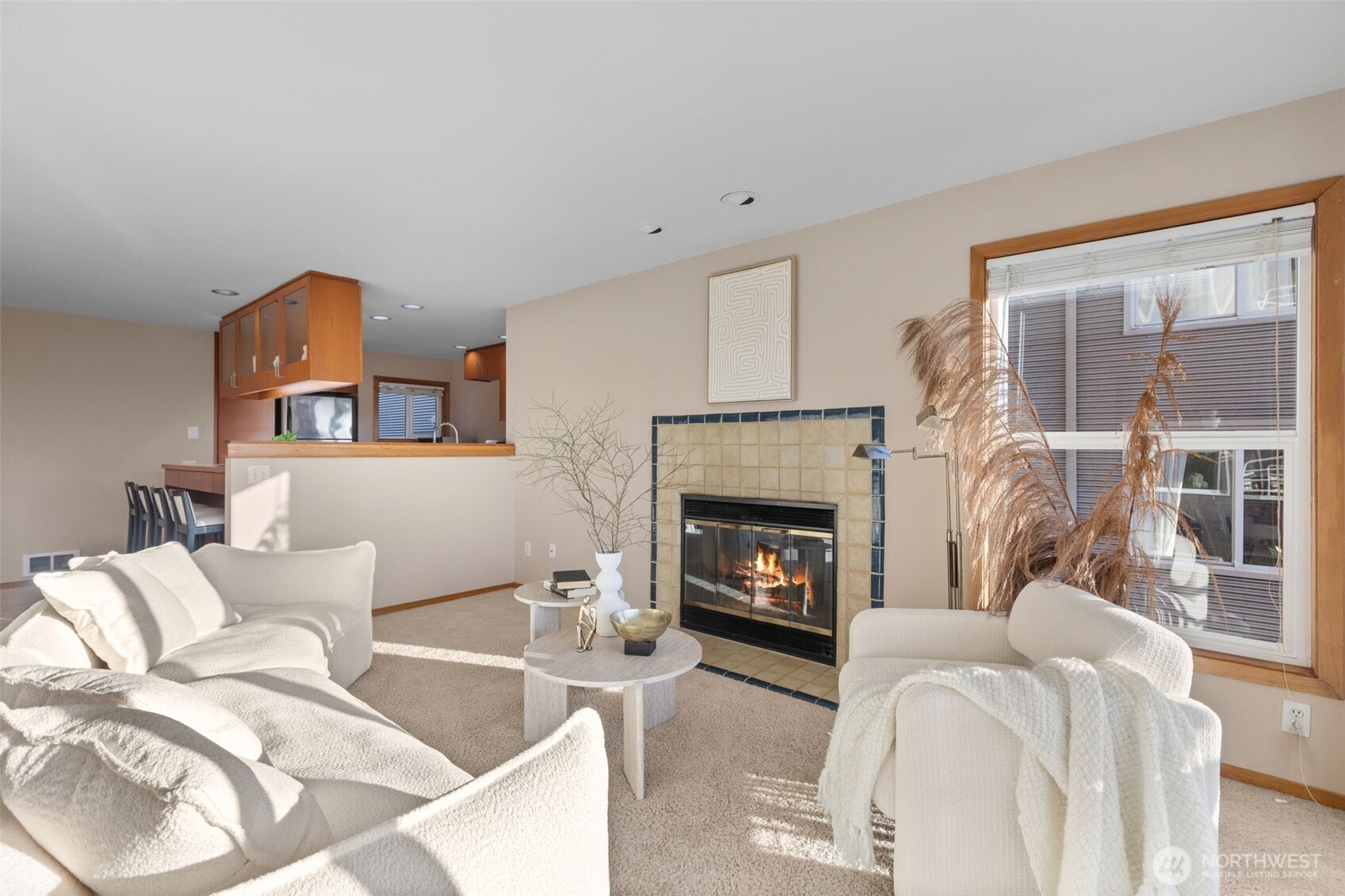 3200 Alki Avenue Southwest, Unit 301 Seattle, WA 98116 - Photo 3 of 29 a living room with furniture and a fireplace