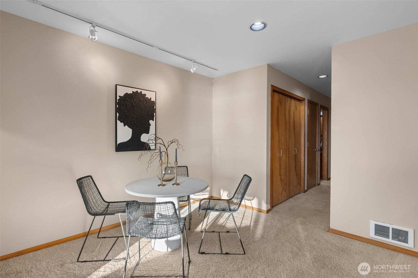 3200 Alki Avenue Southwest, Unit 301 Seattle, WA 98116 - Photo 6 of 29 a view of a dining room with furniture and wooden floor