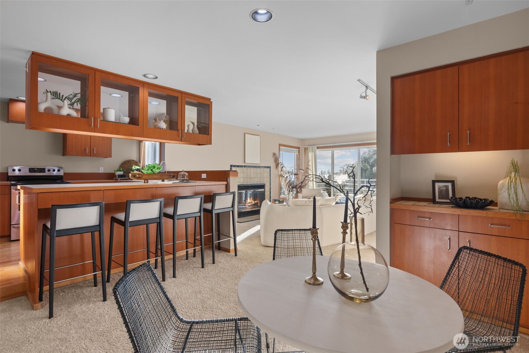 3200 Alki Avenue Southwest, Unit 301 Seattle, WA 98116 - Photo 8 of 29 a dining room with furniture a rug and wooden floor