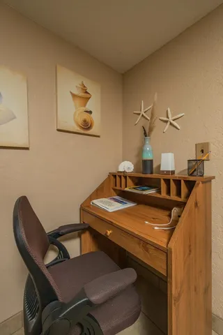 a view of a workspace with furniture