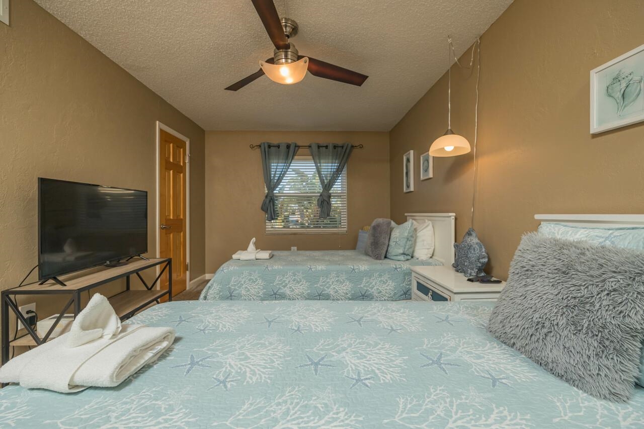 7265 A1A South, Unit B3 St. Augustine, FL 32080 - Photo 23 of 45 a bedroom with a bed and a flat screen tv