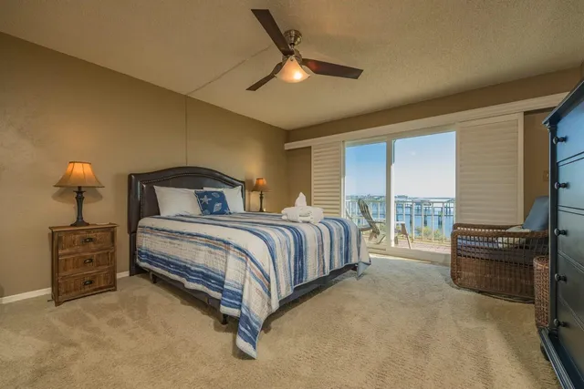 a bedroom with a bed and a tv