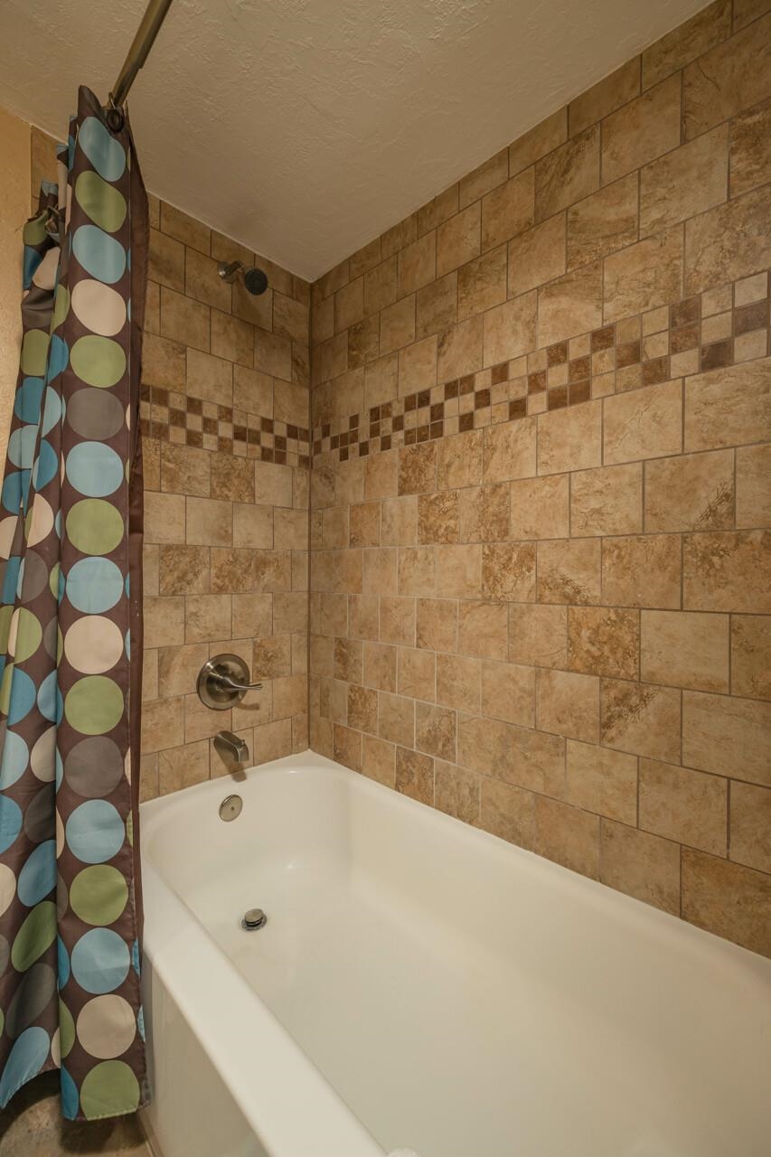 7265 A1A South, Unit B3 St. Augustine, FL 32080 - Photo 26 of 45 a bathroom with a bathtub and shower