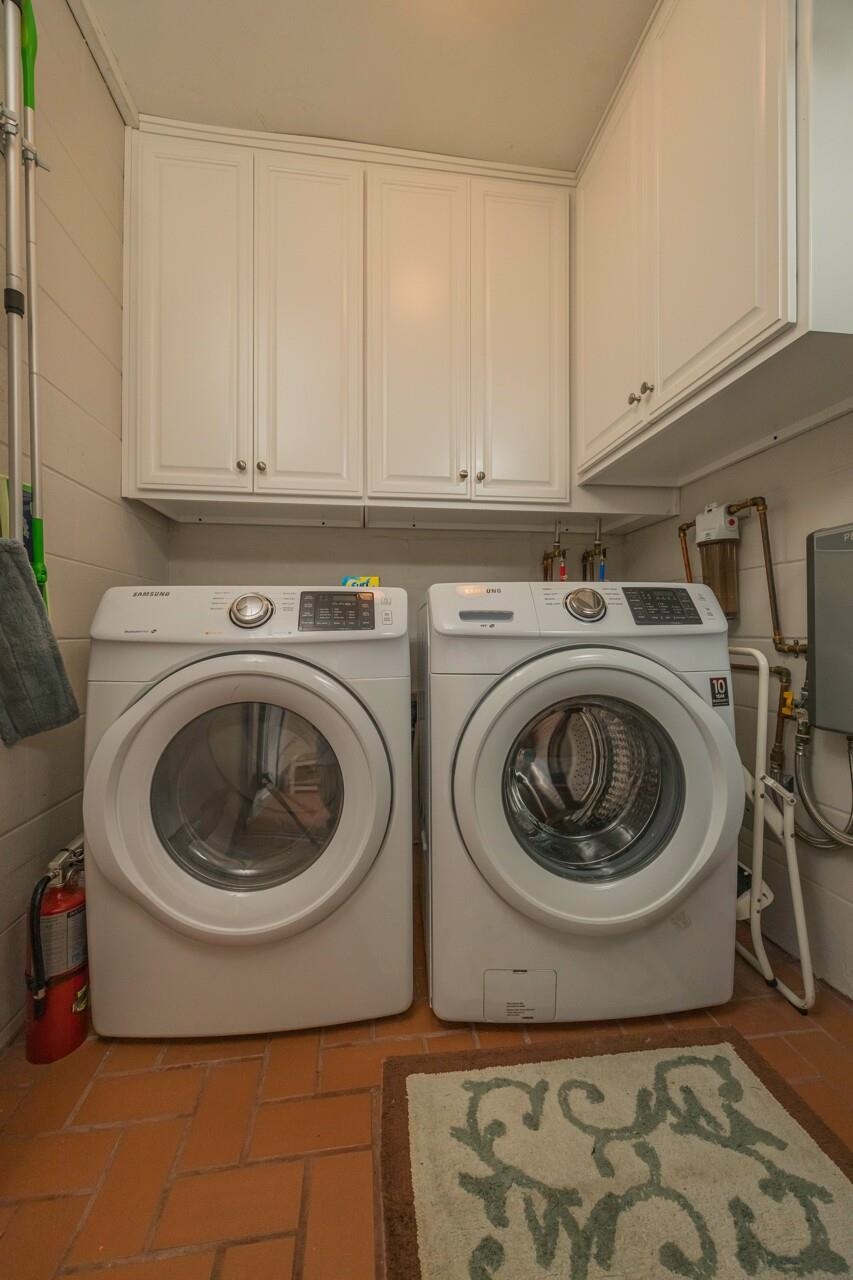 7265 A1A South, Unit B3 St. Augustine, FL 32080 - Photo 33 of 45 a utility room with sink dryer and washer
