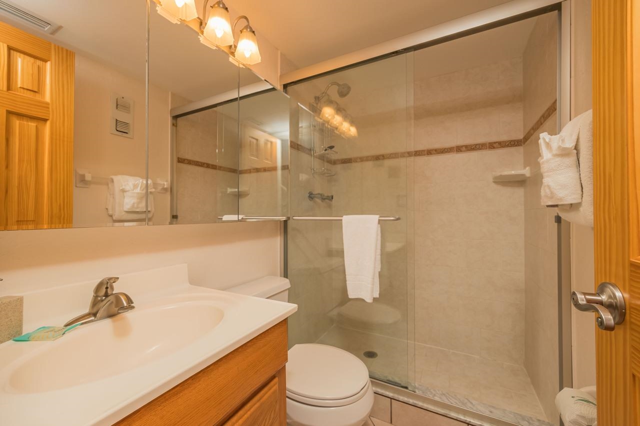 7265 A1A South, Unit B3 St. Augustine, FL 32080 - Photo 35 of 45 a bathroom with a sink vanity mirror and toilet