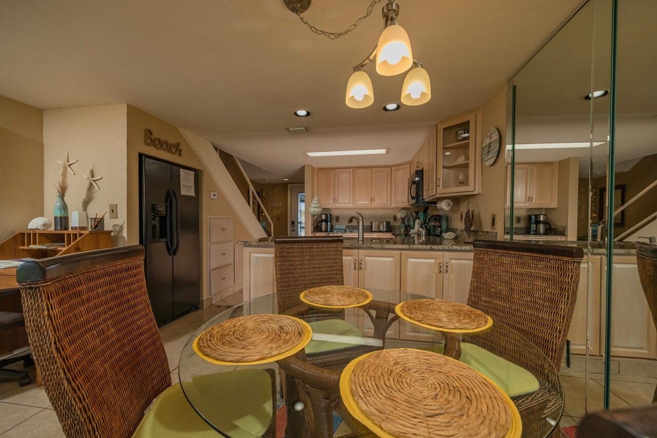 7265 A1A South, Unit B3 St. Augustine, FL 32080 - Photo 41 of 45 a kitchen with stainless steel appliances granite countertop a sink and a refrigerator