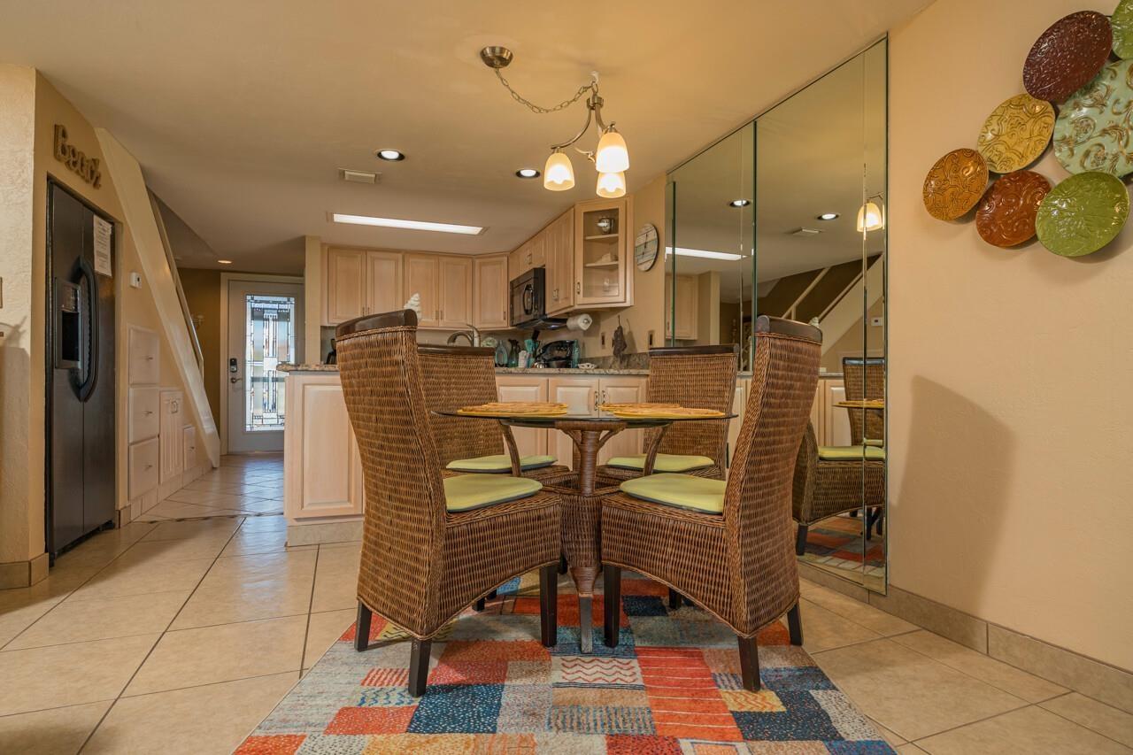 7265 A1A South, Unit B3 St. Augustine, FL 32080 - Photo 42 of 45 a dining room filled with furniture and a chandelier