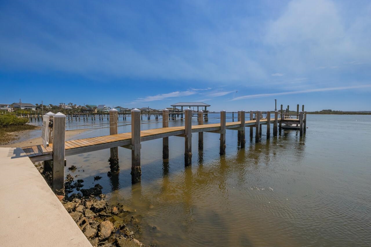 7265 A1A South, Unit B3 St. Augustine, FL 32080 - Photo 6 of 45 a view of a swimming pool with a table and chairs