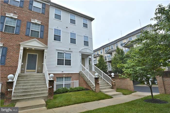 11349 King George Drive, Unit 10 Silver Spring, MD 20902 - Photo 1 of 20 a front view of a house with a yard