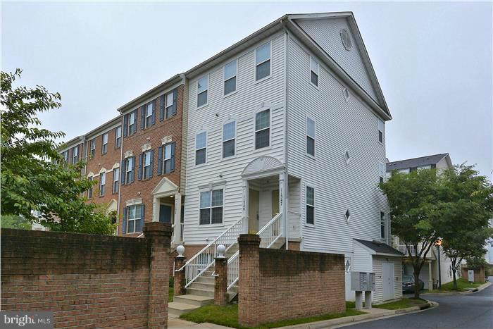 11349 King George Drive, Unit 10 Silver Spring, MD 20902 - Photo 2 of 20 a front view of a house with a yard